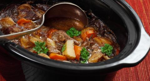 Beef stew in a slow cooker pot.