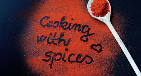 All purpose seasoning blend spread out with message that says cooking with spices.