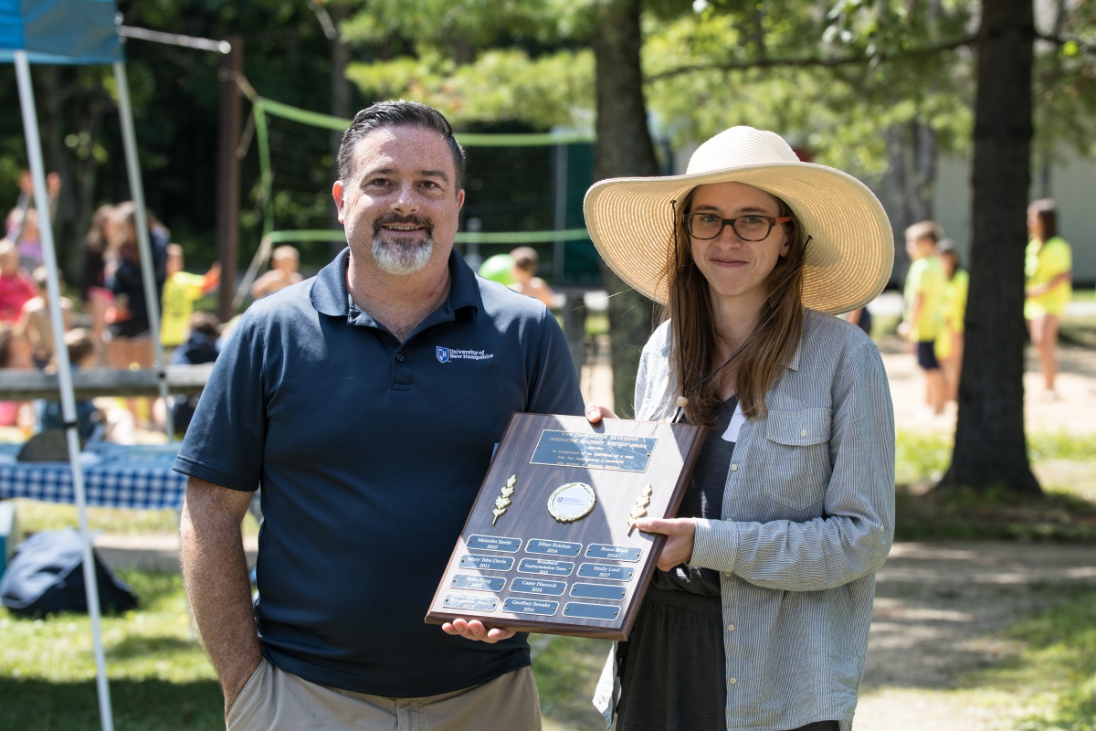 Emily Lord receives the Innovation Award from Ken La Valley