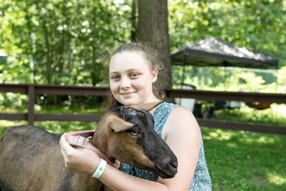 Rockingham County 4-H member holds a goat