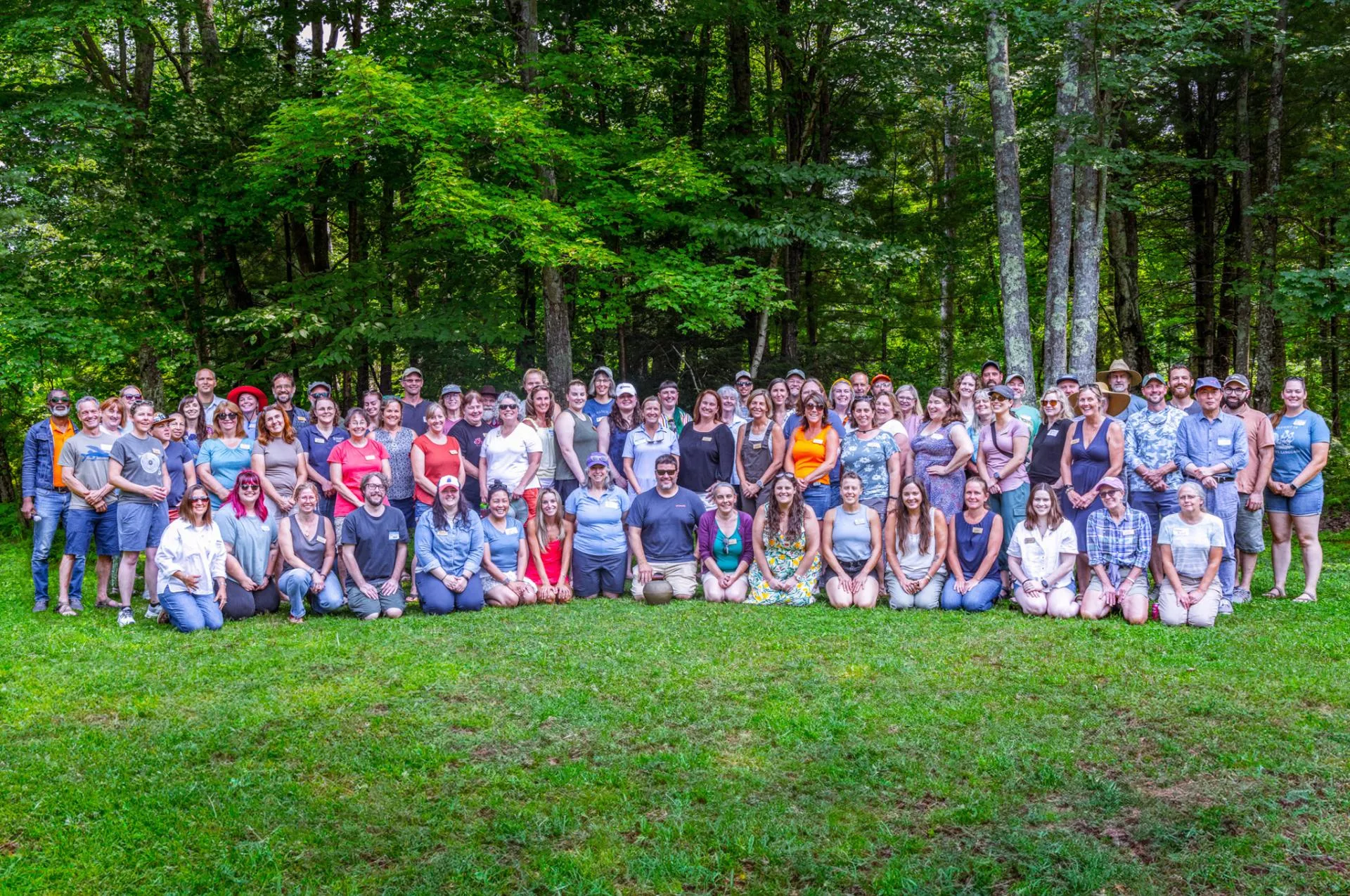 Extension staff group photo outdoors in summer