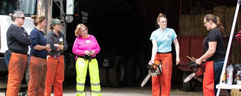 Women learning the basics of chainsaw operation for Annie's project