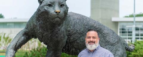 Man and wildcat statue