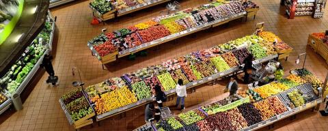 Grocery store layout of fresh fruits and vegetables.