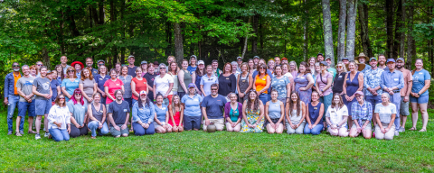 Extension staff group photo outdoors in summer