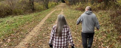 Two people walking on the WOW Trail.