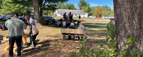 wooden benches being contructed on the town common