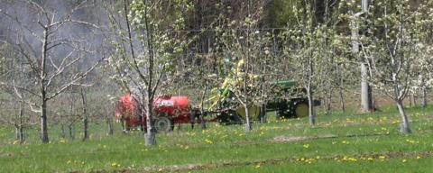 Farmer spraying pesticide in a field