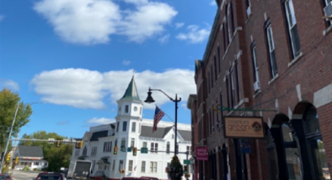 A white building downtown on Main Street
