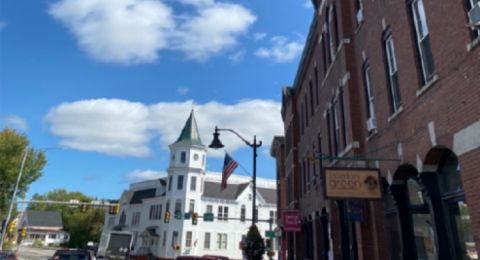  A white building downtown on Main Street