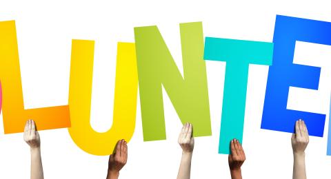 Different colored letters that spell out Volunteer