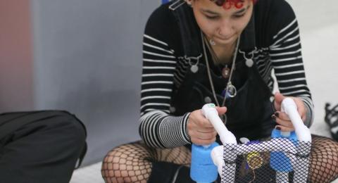 youth working on underwater robot