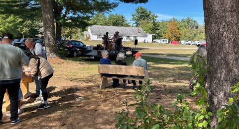 wooden benches being contructed on the town common