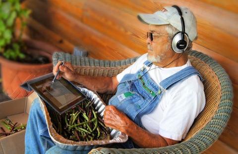 Farmer with headphones on