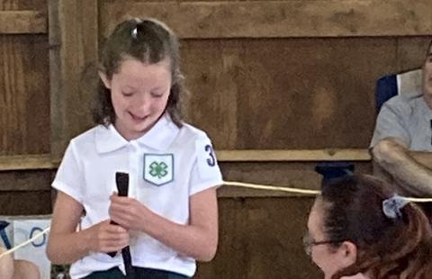 Girl showing her dog to the judge at the fair