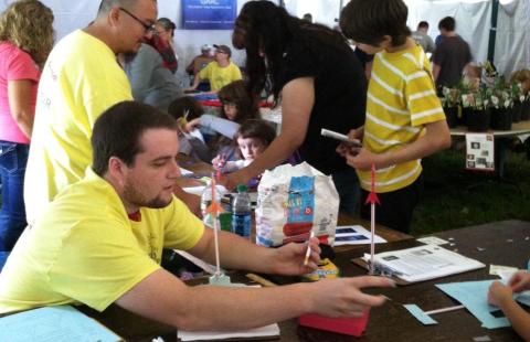 man playing with toy rocket