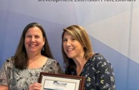 Sue Cagle and Melissa Lee holding NACDEP award certificate