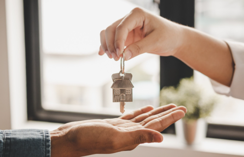 Key is being handed over to homeowner