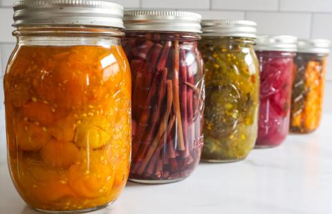 canned and pickled vegetables in canning jars