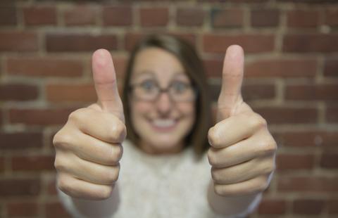 woman giving thumbs up