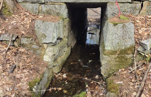 Old stone railroad bridge over a stream in Barrington near the new library.