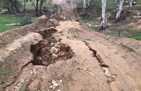 badly washed out or eroded dirt road