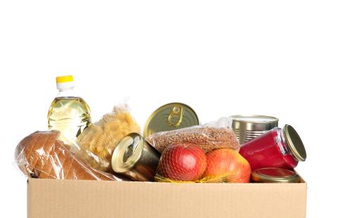 box of assorted canned, jarred, and fresh donated food