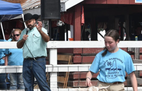 girl in show ring with goat 