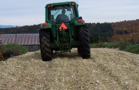 tractor packing corn silage