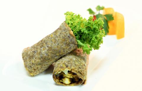 Vegetable wrap sandwich using whole grain wrap.
