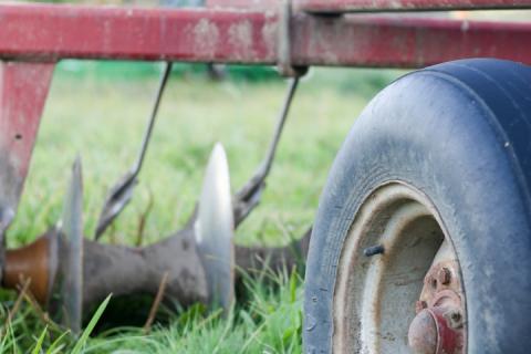 farm equipment in grass 