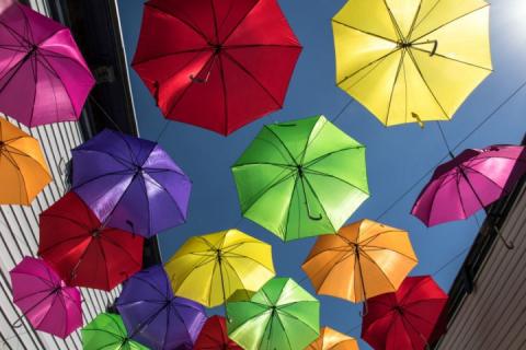 looking up into colorful umbrellas 