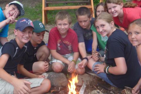 young people at campfire