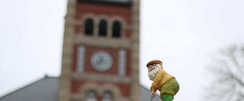 small gnome playing golf