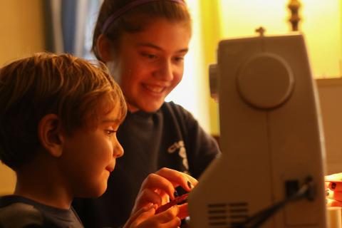 4-H youth with sewing machine