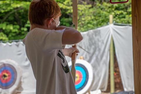 4-H youth practicing archery