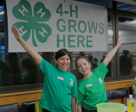 Two girls being happy about being part of the 4-H program.