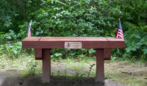 Bench in Hood Park with American flags