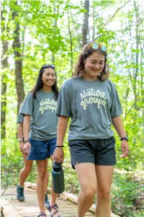 three nature groupie interns in the woods