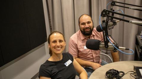 Emma and Nate in a podcast recording studio