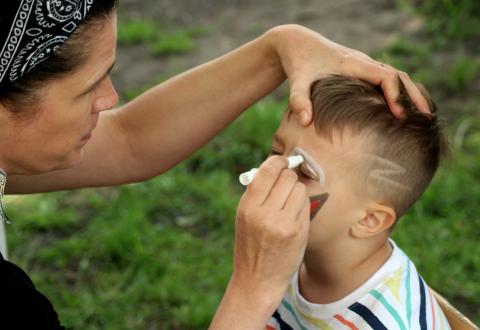 Child's face being painted