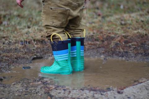 Child with muddy boots