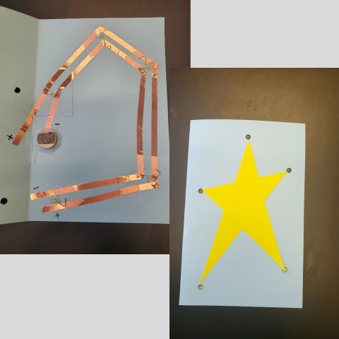 Picture of two paper cards and circuits.