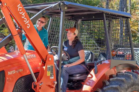 woman operating a tractor