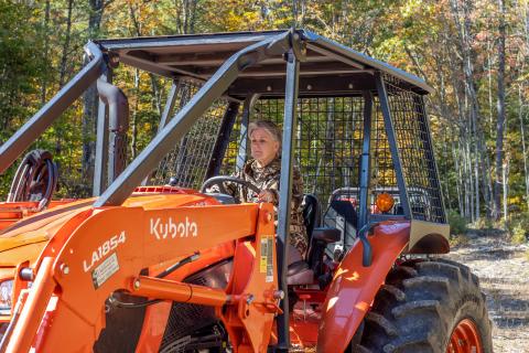 women's tractor logging workshop participant on tractor