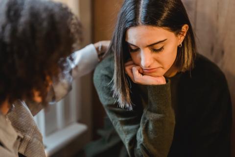 teen comforted by woman