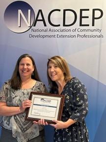 Sue Cagle and Melissa Lee holding NACDEP award certificate