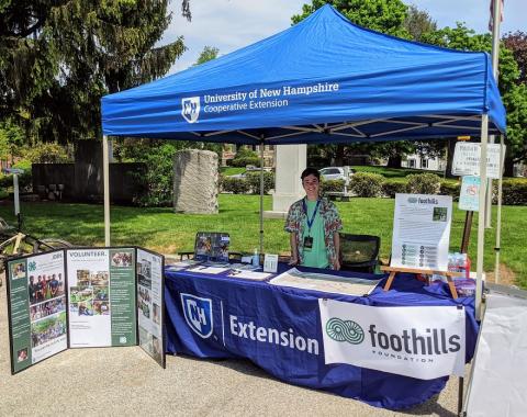 Summer intern, Troy, at UNH Extension booth 