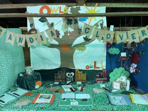 A 4-H display with handcrafted owls.
