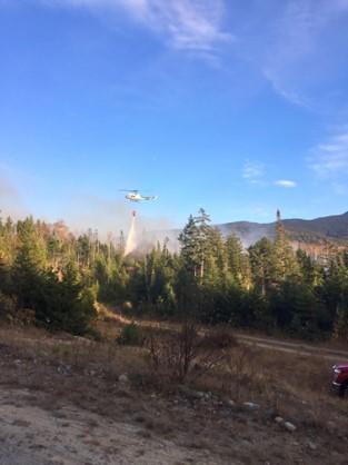 Helicopter putting out a forest fire